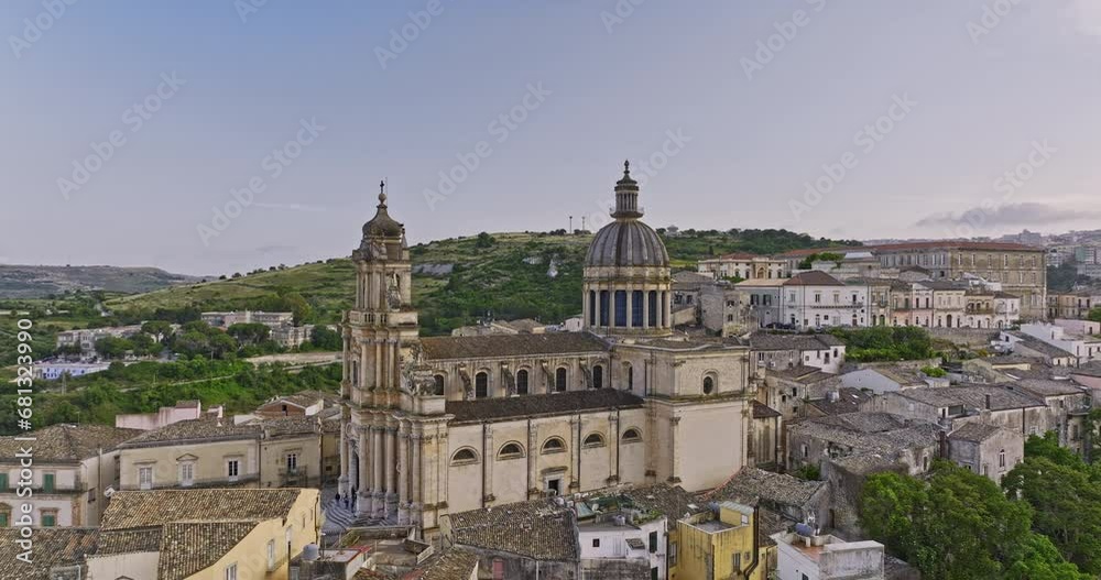 Ragusa Italy Aerial v6 drone flyover and around old baroque architectural Duomo di San Giorgio cathedral church nestled on the hillside within the historic town - Shot with Mavic 3 Cine - June 2023 Ragusa Italy Aerial v6 drone flyover and around old baroque architectural Duomo di San Giorgio cathedral church nestled on the hillside within the historic town - Shot with Mavic 3 Cine - June 2023