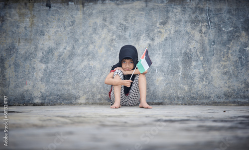 Sad Little girl holding Palestine Flag sends a powerful message of support and empathy to the world 