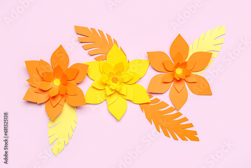 Colorful origami flowers with leaves on purple background © Pixel-Shot