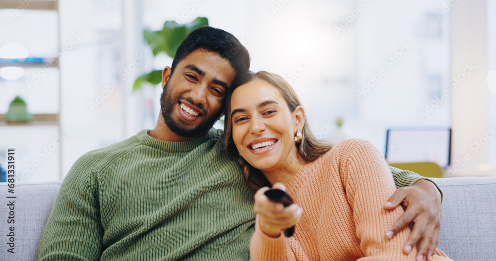 Couple, watching tv and remote on living room couch with smile, hug or relax with click for choice, show or film. Man, woman and happy together for embrace, movie or streaming on lounge sofa in home - obrazy, fototapety, plakaty 