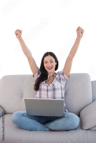 Digital png photo of happy caucasian woman with laptop, raising arms on transparent background © vectorfusionart