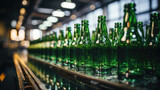 Green beer bottles on the production line, horizontal photo shows group of green beer bottles.factory background