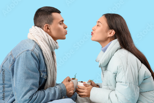Happy couple in warm clothe...