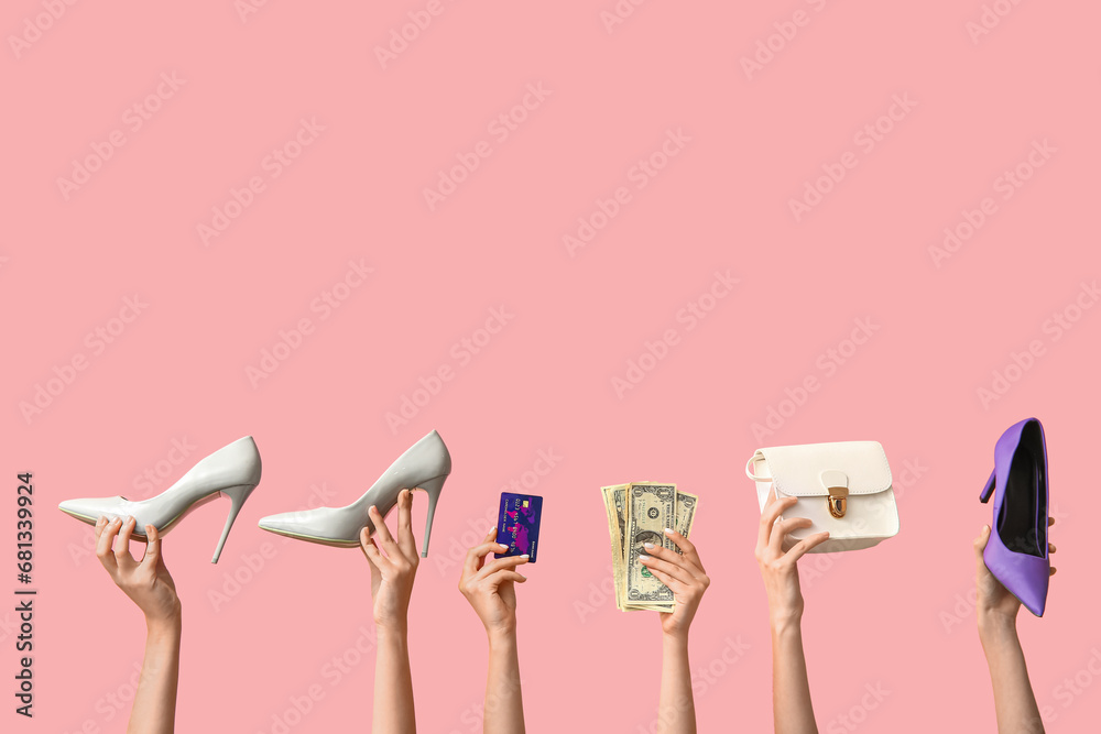 Female hands with shoes, money, purse and credit card on pink background. Black Friday sale - obrazy, fototapety, plakaty 