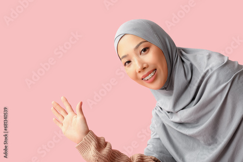Smiling young muslim woman ...