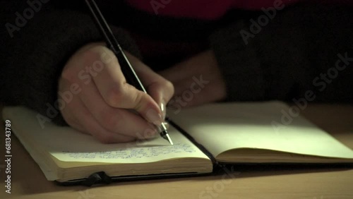Close-up of fountain pen writing in an old-fashioned paper notebook or diary