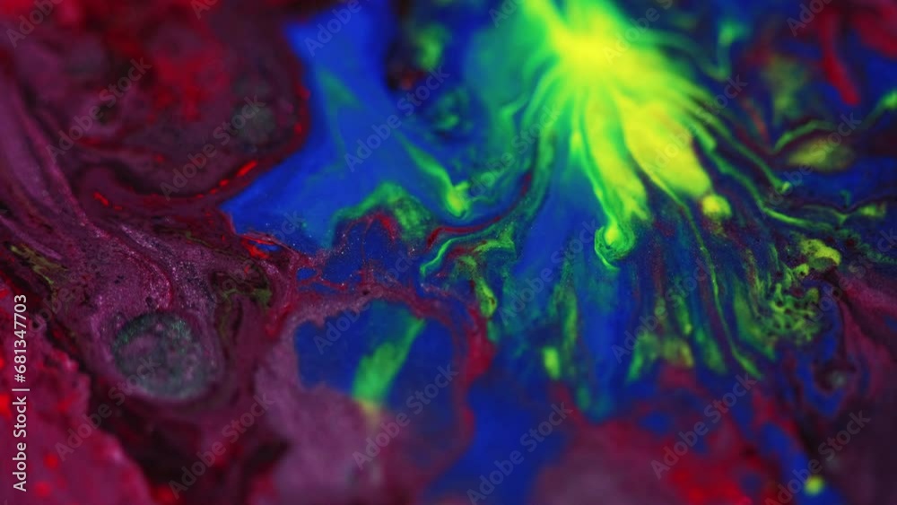 Paint drop. Ink mix in water. Wet splash. Defocused neon green blue red color liquid wave blend flow motion abstract art background. Paint drop. Ink mix in water. Wet splash. Defocused neon green blue red color liquid wave blend flow motion abstract art background.