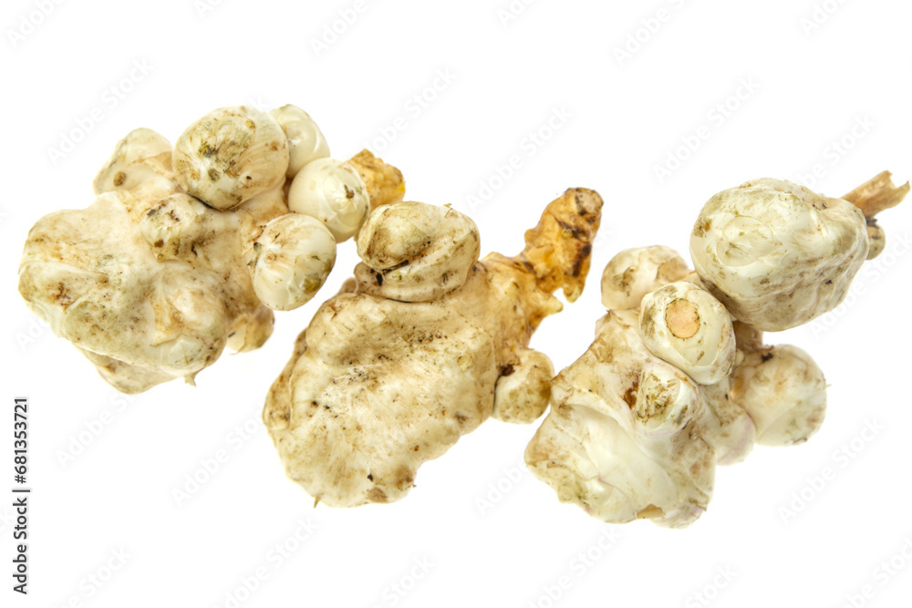 Jerusalem artichoke sweet potato tubers on white background. Jerusalem artichoke sweet potato tubers on white background.