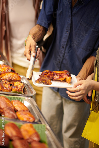 Couple buying street food at local market