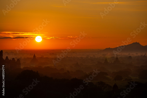 group of ancient pagodas in Bagan at the sun set, myanmar