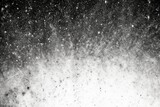 Monochrome image of a dynamic powder explosion, suitable for high-energy design backgrounds and artistic visuals.