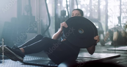 Woman, fitness and weightlifting at gym for exercise, workout or training in strength, core or muscle gain. Active female person, athlete or bodybuilder lifting weight for power, health and wellness photo