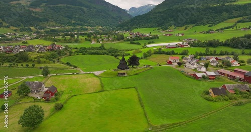 Historic Hopperstad parish Stave church in verdant countryside, Norway. Aerial photo