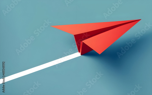 red paper plane on a blue background