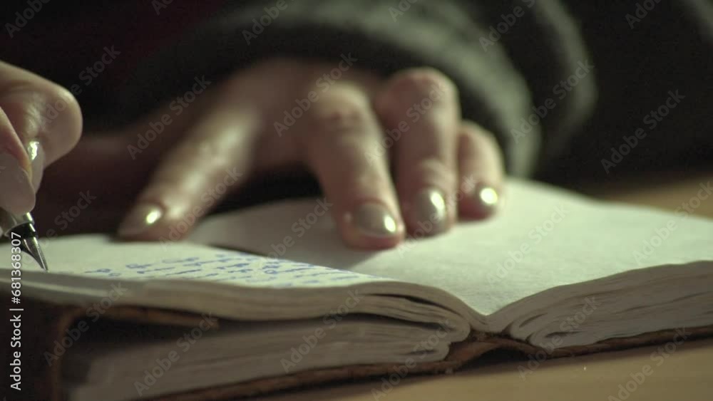 Close-up of fountain pen writing in an old-fashioned paper notebook or diary