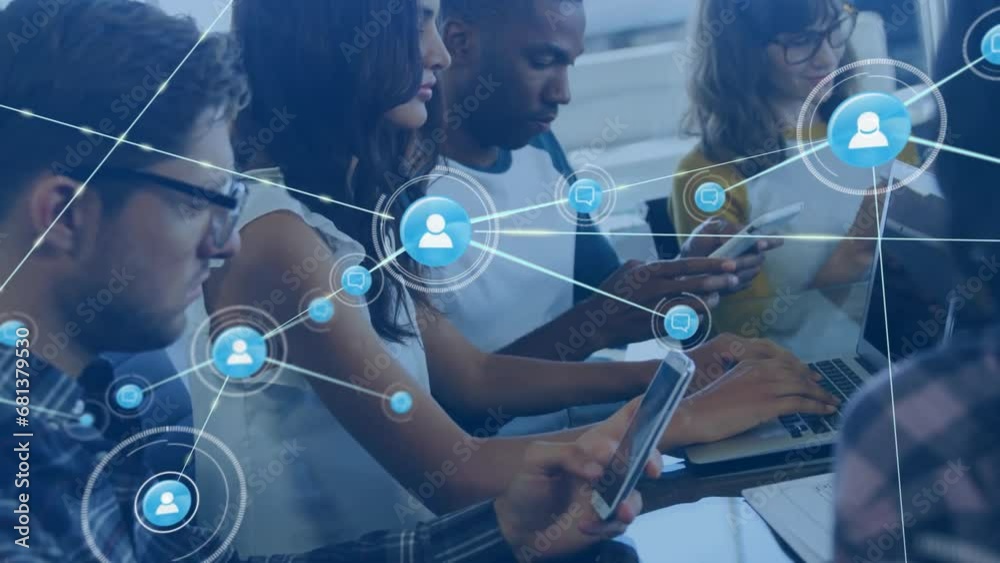 Animation of connected icons over diverse coworkers using cellphone and laptop in office