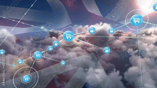 Animation of connected icons and flag of united kingdom flag, aerial view of dense clouds in sky photo