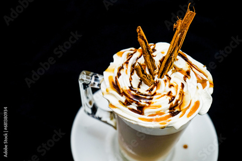 Whipped cream homemade on coffee and vanilla in glass.