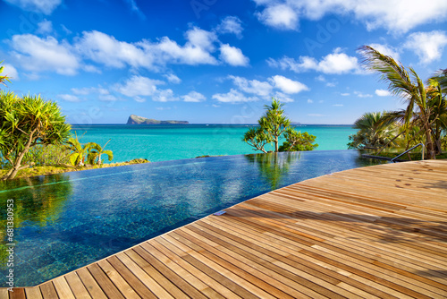 The view from the resort has a pool overlooking the sea and mountains.