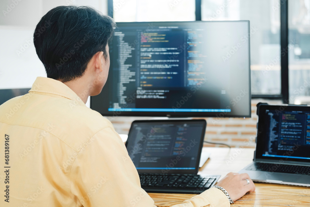 IT Programmer Starts Working on Desktop Computer. IT Programmer Starts Working on Desktop Computer.