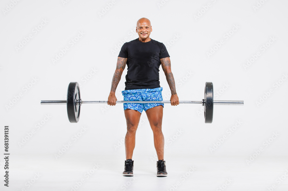 Portrait isolated cutout full body studio shot strong African American male fitness athlete sportman trainer model in casual sport workout outfit posing lifting barbell training on white background Portrait isolated cutout full body studio shot strong African American male fitness athlete sportman trainer model in casual sport workout outfit posing lifting barbell training on white background