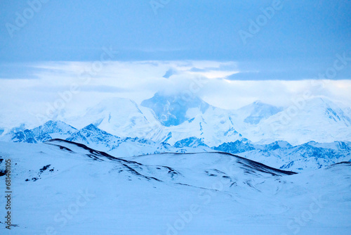 Khan-Tengri peak . Khan Tengri is a mountain of the Tian Shan mountain range. Khan Tengri is a massive marble pyramid, covered in snow and ice. 