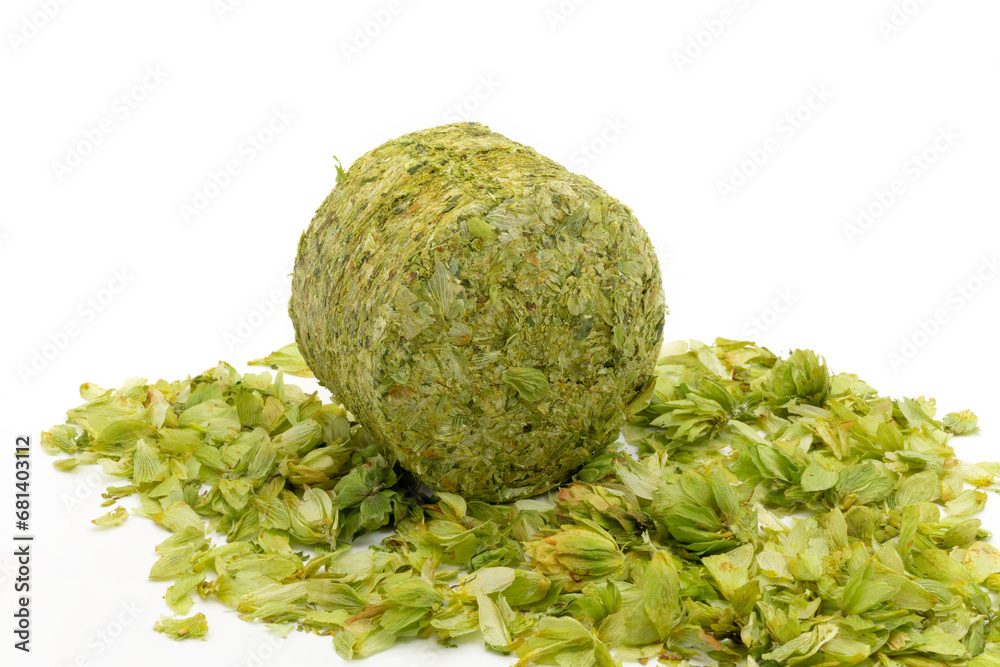 Dried hops - pressed hop puck with hop leafs photographed on white background - Czech hops from the Žatec region - Czech Republic, Europe