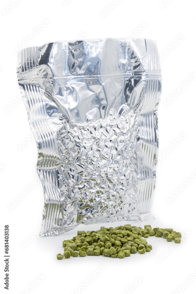 Aluminium bag with vacuumed hop granules with a pile of green hop pellets - Žatec, Czech Republic