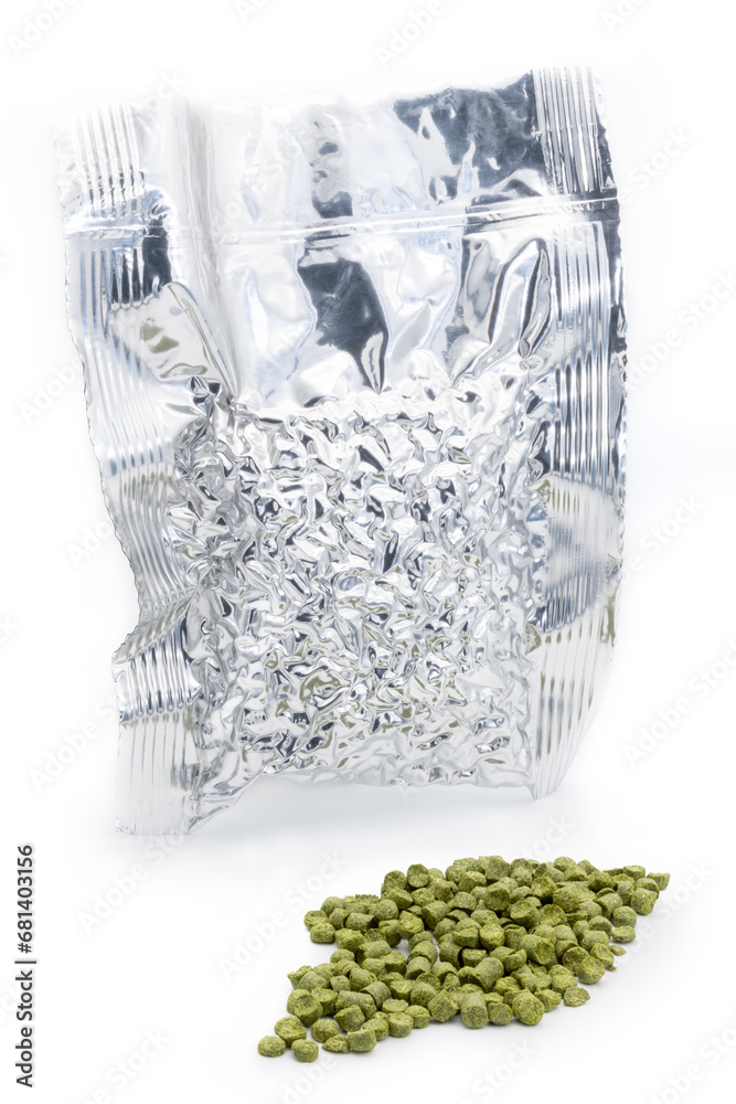Aluminium bag with vacuumed hop granules with a pile of green hop pellets - Žatec, Czech Republic