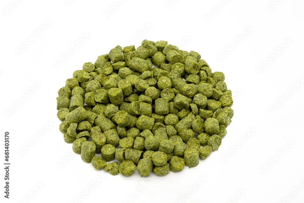 Pile of green hops pellets on white background.