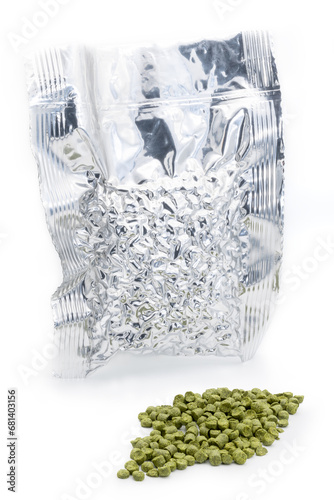 Obraz na płótnie Aluminium bag with vacuumed hop granules with a pile of green hop pellets - Žatec, Czech Republic w salonie
