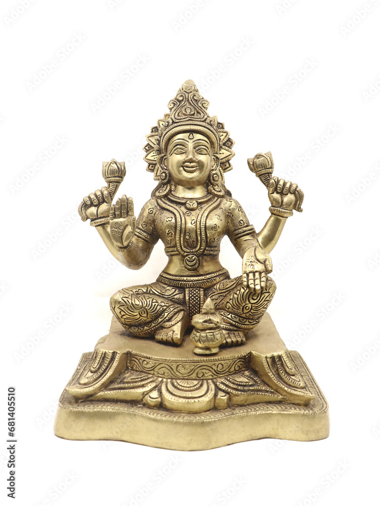 frontb view of a brass idol of hindu goddess lakshmi stitting with multiple arms, symbol of wealth and prosperity isolated 