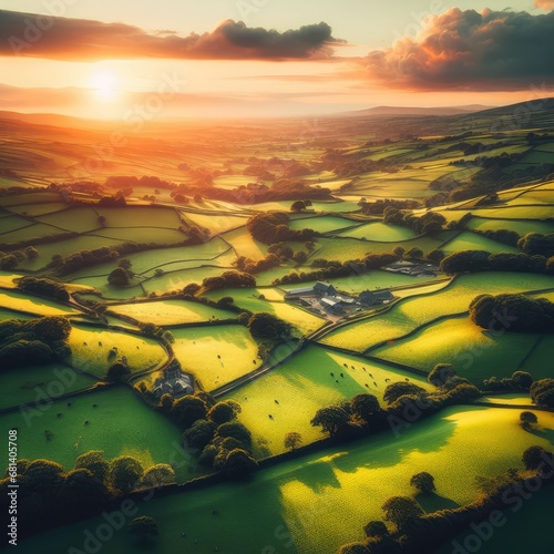 Aerial view of endless lush pastures and farmlands of Ireland. Beautiful Irish countryside with emerald green fields and meadows. Rural landscape on sunset