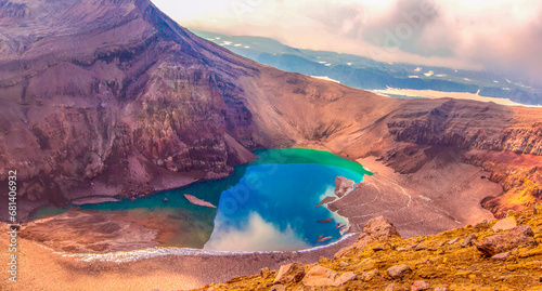 Green lake in the mouth of Gorely volcano on Kamchatka peninsula photo