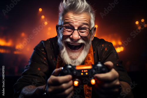 Happy perky elderly man holding a gamepad in his hands, playing video games.