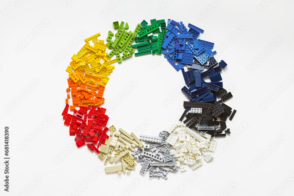 Obraz premium Lot of colorful rainbow toy bricks in circle shape on white. Diagram toy building block, bricks. Graph, chart, statistic. Top view. Lego blocks. Novosibirsk, Russia - October 26, 2023.