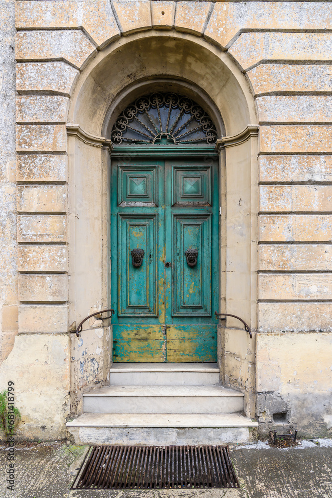 Old Maltese wooden door with peeling paint