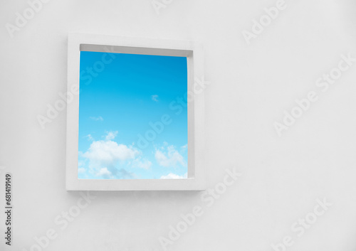 White Wall texture of concrete with open window against blue sky and clouds inSummer  Exterior Cement building with border frame with Spring sky Ant view Modern architecture. Minimal design
