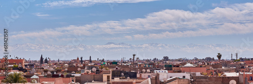 View of the rooftops of Marrakech and the Atlas Mountains in the distance