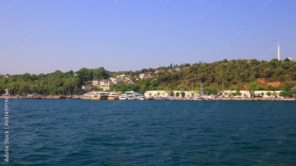 Seascape overlooking the coast of Istanbul. The ship sails and leaves a foamy trail in the water. Seascape overlooking the coast of Istanbul. The ship sails and leaves a foamy trail in the water.