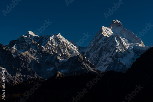 Early morning sunrise in the hImalayas of Nepal with Mt. Kumbhakarna (Jannu HImal) and mountains photo