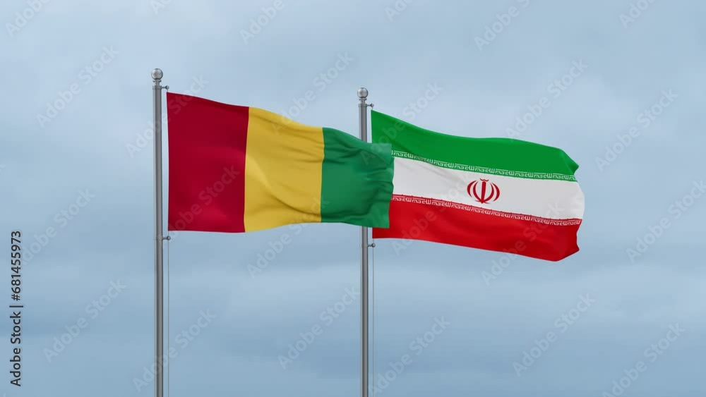 Iran flag and Republic of Guinea flag waving together on blue sky, looped video Iran flag and Republic of Guinea flag waving together on blue sky, looped video