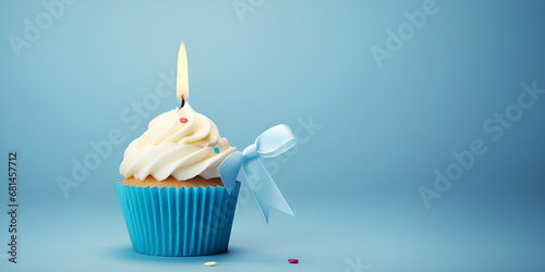 Birthday cupcake with candle for boy on blue background .A Whirlwind of Wishes, Birthday Cupcake Delight for the Young Explorer .