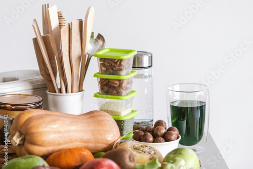 Set of healthy food and kitchen accessories, fresh smoothie on a table, close-up, copy space, selective focus. photo