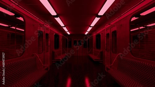 Moving slowly down the center of an old abandoned subway train with creepy red lights flickering overhead. photo