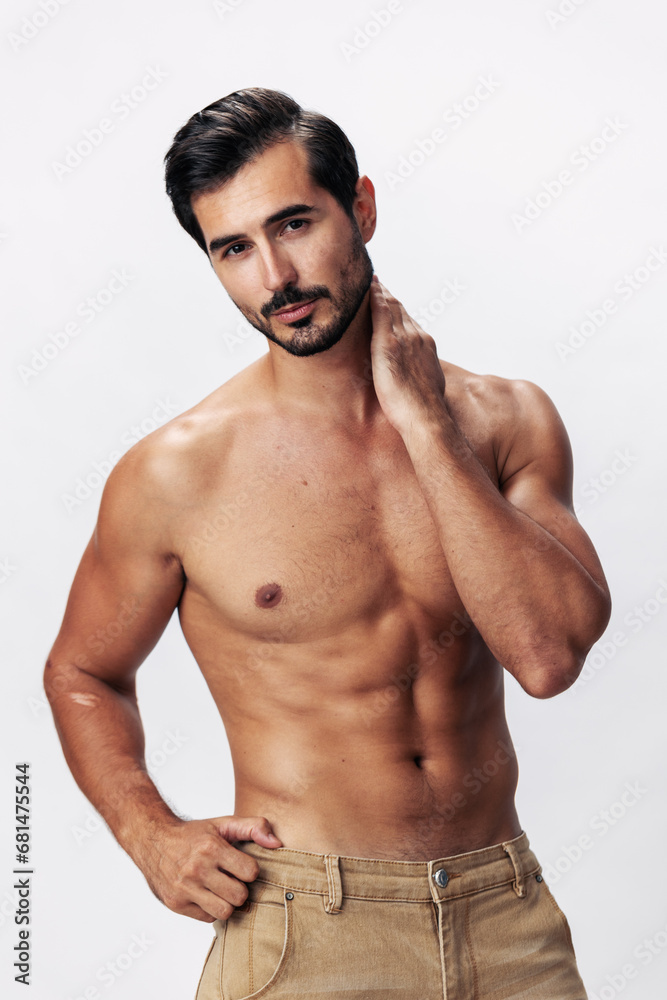 Fototapeta premium Male athlete model with naked torso and packs of abs sporty on white isolated background, trendy clothing style, copy space, space for text