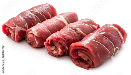 Raw beef roulades isolated on white background, cut out photo