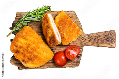 Crispy Cordon Blue Chicken fillet roll with ham and cheese served  on a wooden board.  Transparent background. Isolated. photo