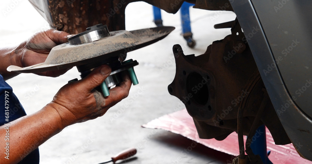 Obraz premium Close up Man hands fixing Car machinery vehicle mechanical service. Mechanic man hands repairing car auto repair shop. open vehicle hood checking up auto mobile. Vehicle Car maintenance engineer.