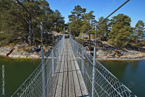 Suspension bridge on hiking track on Stora Krokholmen in Stendörrens Naturreservat in Sweden, Europe
 photo